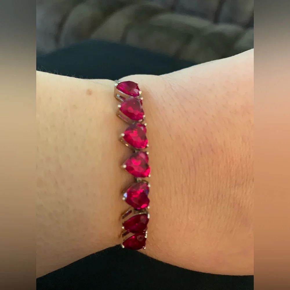 Rhodium over sterling silver lab ruby heart bolo bracelet